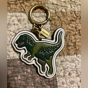 Coach Green Dinosaur Keychain with Gold Accents